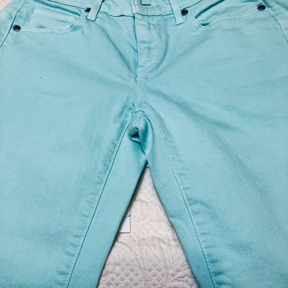 Beautiful aqua color jeans.